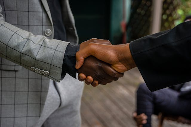 two-people-shaking-hands-for-work
