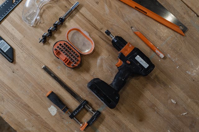 wooden-workbench-with-neatly-arranged-tools-and-power-drill wooden-workbench-with-neatly-arranged-tools-and-power-drill