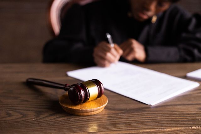 judge at a desk with a gavel