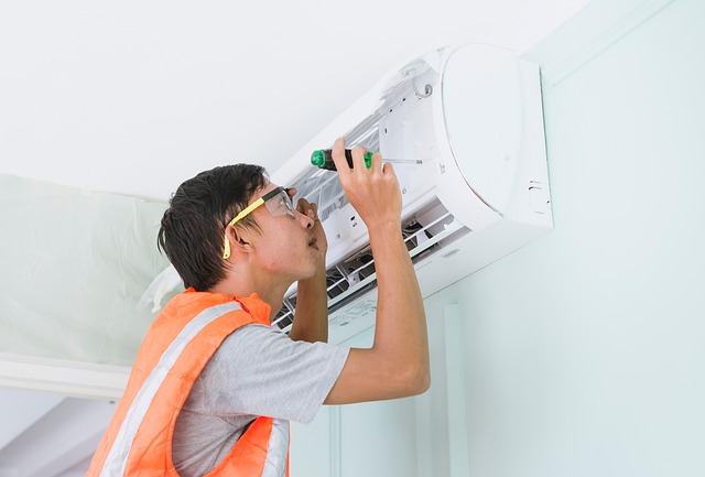 person repairing an air conditioner